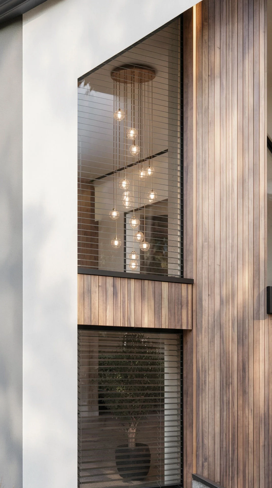 Exteriér – Rodinný dům Lazínov, závěsné osvětlení u prosklení
